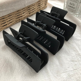 Nalodu hair claw clips displayed on a vanity
