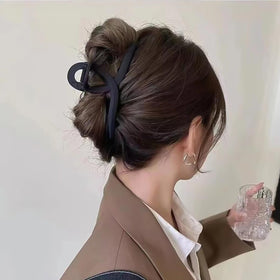 Nalodu hair claw clips on a travel bag for easy access