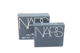NARS Blush Orgasm X compact powder with swatch on skin
