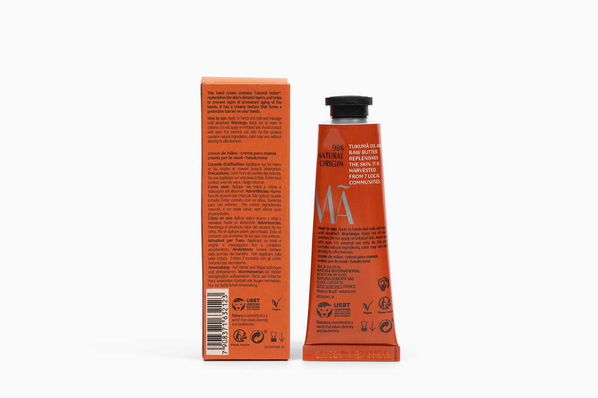 Natura Tukumã Hand Cream with tropical plants background
