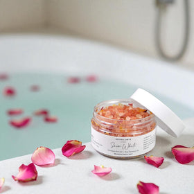 NATURAL AMOR bath body gift set displayed in a serene bathroom setting