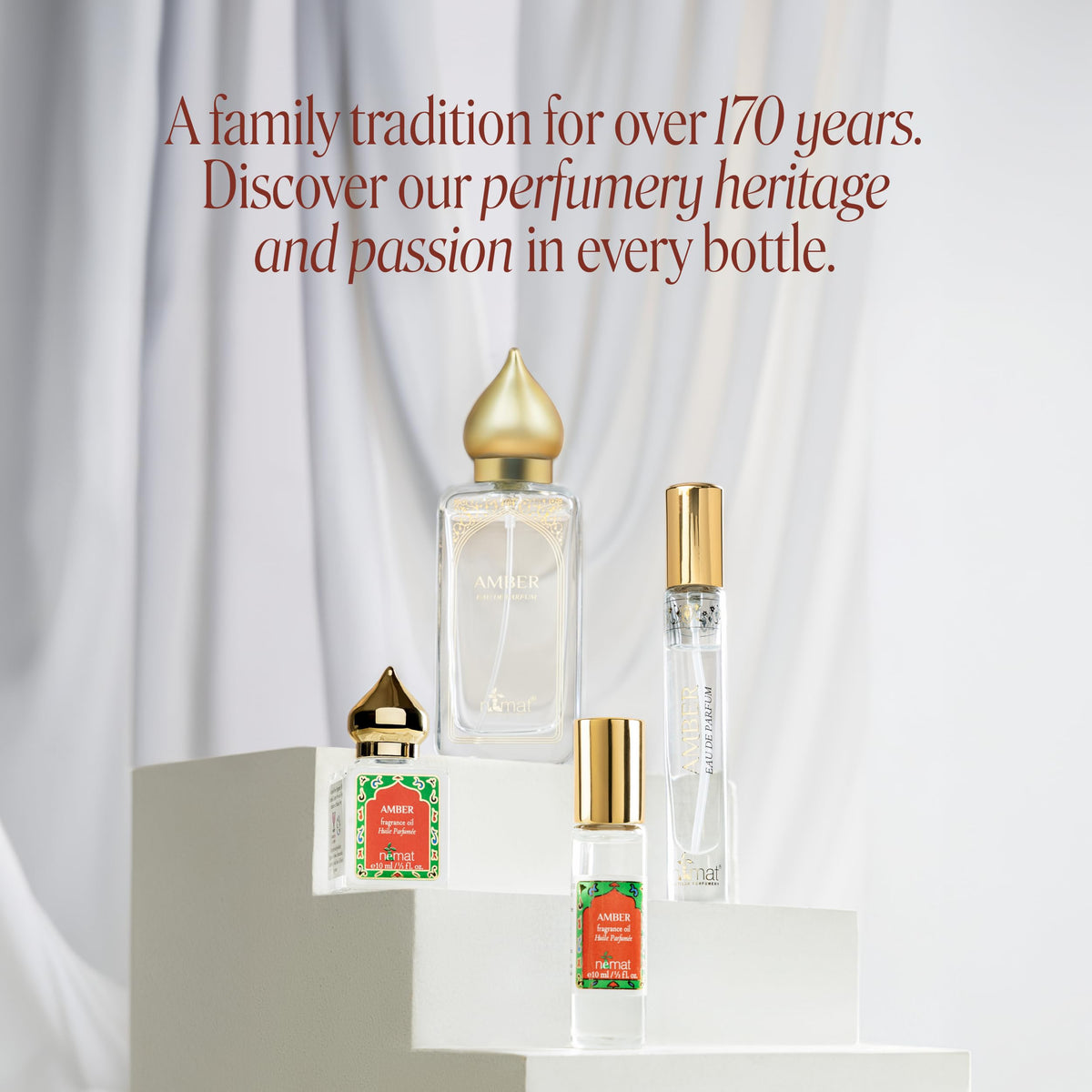 Nemat Amber EDP Travel Spray 9ml with floral background