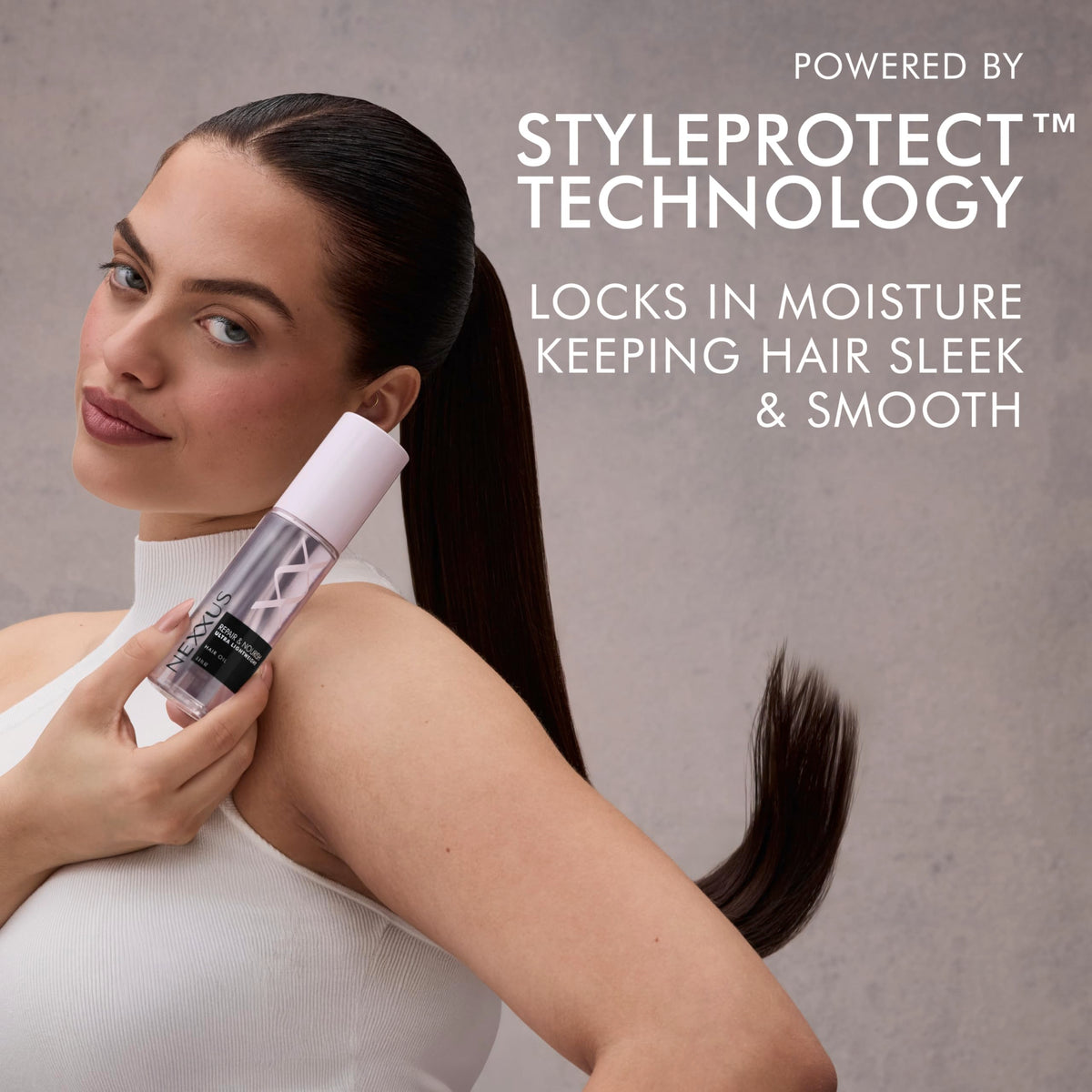 Nexxus Hair Oil 4 oz with a styling tool in background