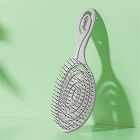 Ninabella Detangler Brush in a travel bag