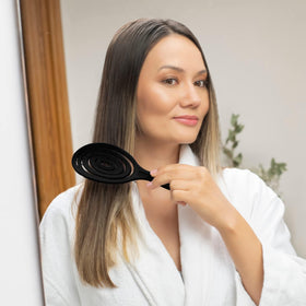 Ninabella Detangler Brush in a travel bag