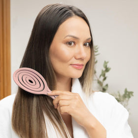 Ninabella Detangler Brush in use on wet hair