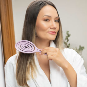 Ninabella Detangler Brush in use on wet hair