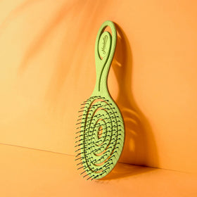 Ninabella Detangler Brush on a bathroom counter