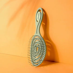 Ninabella Detangler Brush with cardboard packaging
