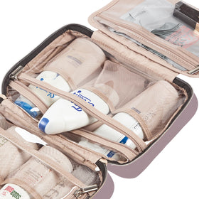 NISHEL Toiletry Bag being packed in a suitcase