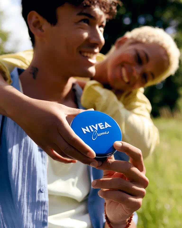 NIVEA Creme 8.4 oz tin in a travel bag for hydration on the go
