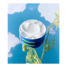 NIVEA Creme 8.4 oz tin next to a towel and skincare products