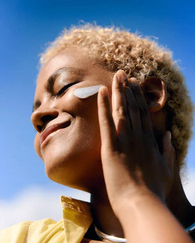 NIVEA Creme 8.4 oz tin with hands applying cream on skin