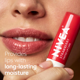 NIVEA Strawberry Lip Care lip balm in a purse