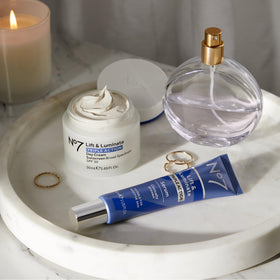 No7 Lift & Luminate Serum 50ml on a vanity table