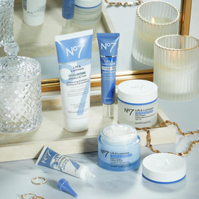 No7 Lift & Luminate Skincare Set displayed on a bathroom shelf