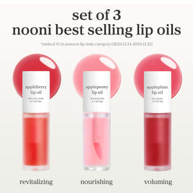 NOONI Lip Oil in Appleplum shade next to fruit