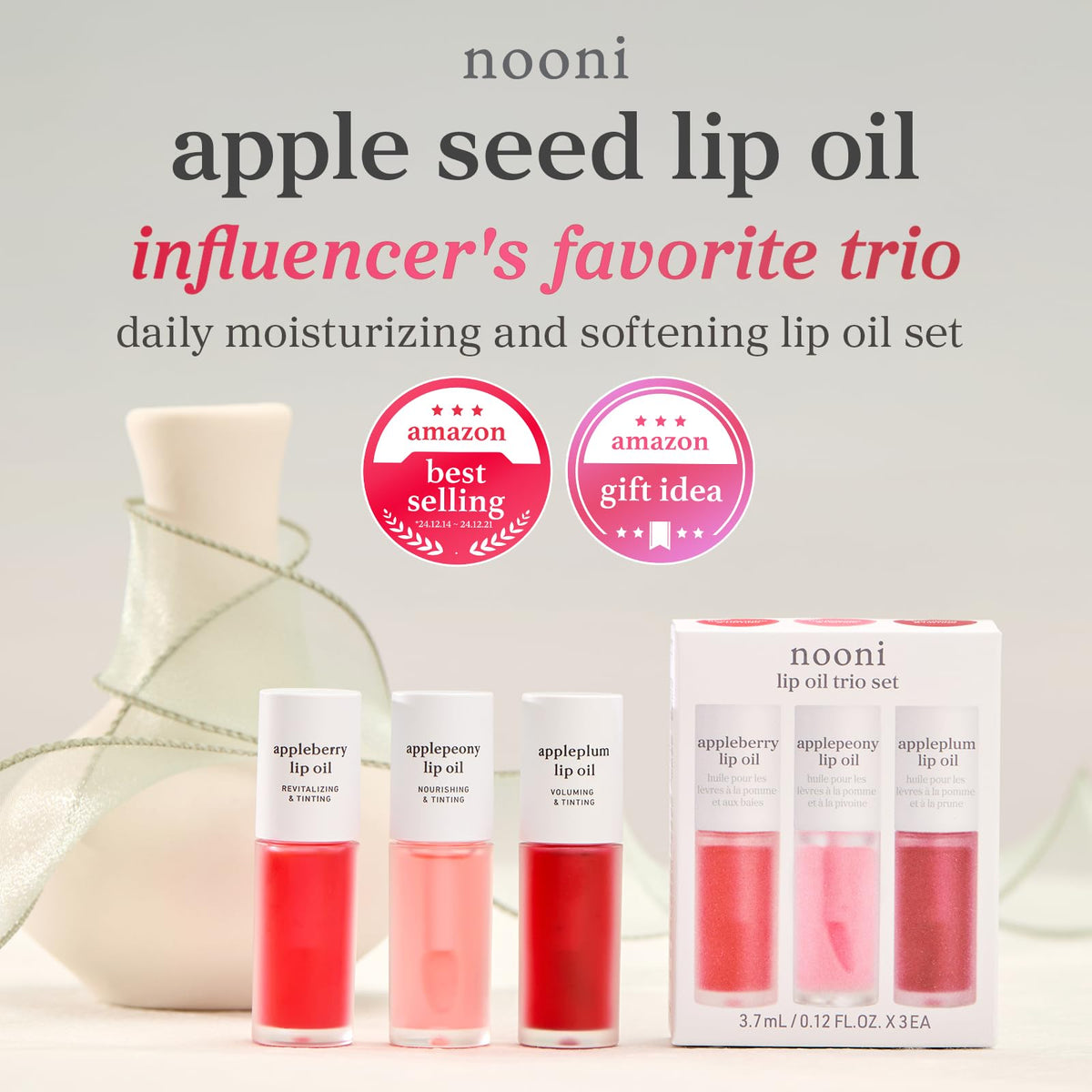 NOONI Lip Oil Set lifestyle shot with makeup essentials