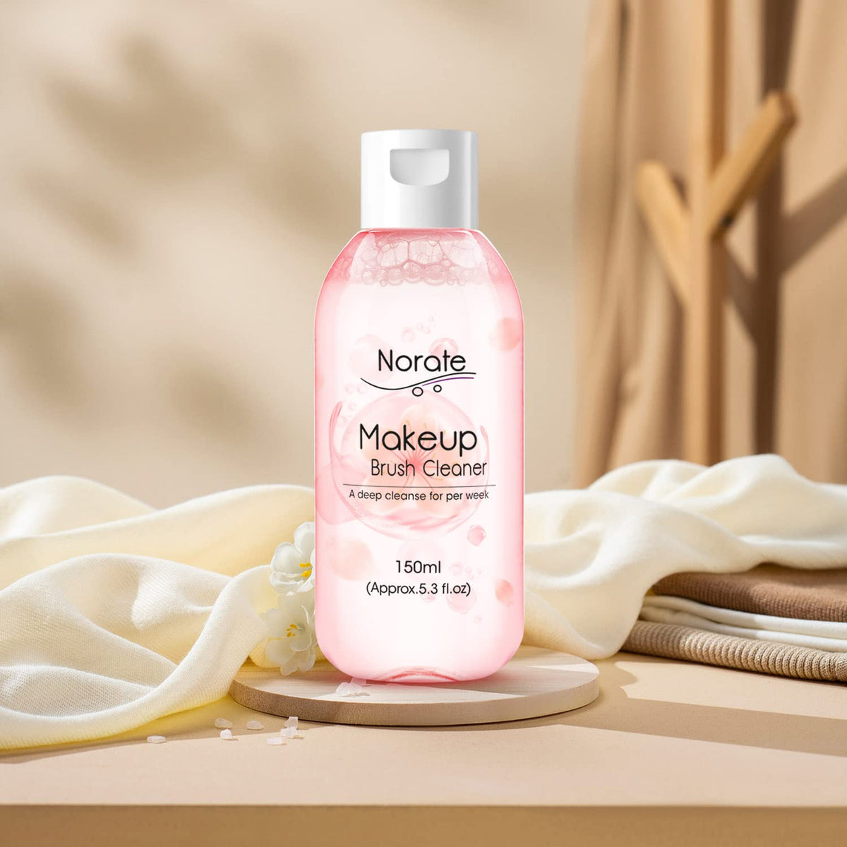 Norate Makeup Brush Cleaner with various brushes around
