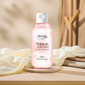 Norate Makeup Brush Cleaner with various brushes around