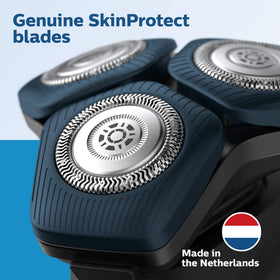 Norelco replacement heads in a lifestyle setting on a bathroom shelf