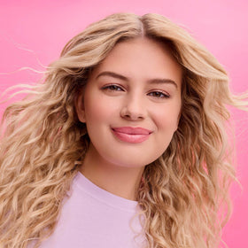 Not Your Mother's Curl Defining Shampoo and Conditioner on a bathroom shelf