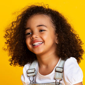 Not Your Mother's Kids Hair Detangler Spray back view with bottle