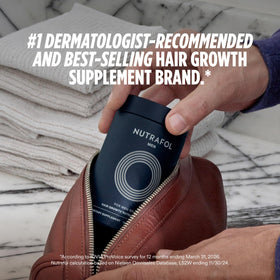 Nutrafol Men 50+ Hair Growth Supplements capsules on a table