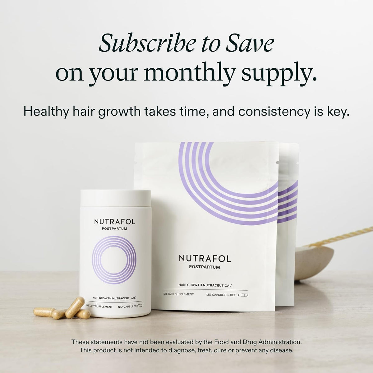 Nutrafol Postpartum Hair Growth Supplements packaging on a table