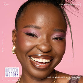 NYX Make 'Em Wonder Liquid Foundation 42 Deep Walnut with makeup brush