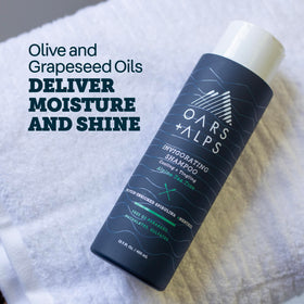 Oars + Alps Conditioner bottle close-up highlighting Witch Hazel
