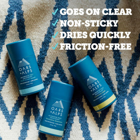 Oars + Alps deodorant sticks arranged on a bathroom counter