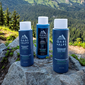 Oars + Alps Shampoo bottle close-up showing Tea Tree Oil