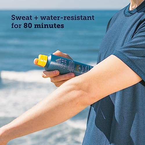 Oars + Alps SPF 30 Body Sunscreen Spray lifestyle scene at the beach