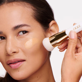 Ogee Professional Quality Makeup Brush in use applying liquid foundation on skin