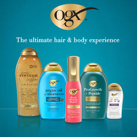 OGX Coconut Coffee Body Scrub on a wooden surface