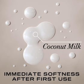 OGX Nourishing + Coconut Milk Shampoo in a bathroom setting