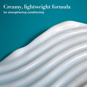 OGX ProGrowth + Peptide Conditioner on a bathroom shelf