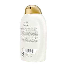 OGX Quenching + Coconut Curls Conditioner in bathroom setting