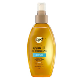 OGX Renewing Argan Oil Dry Oil 4 Fl Oz on a bathroom shelf