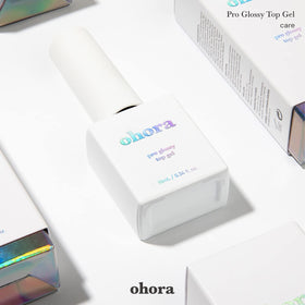 ohora Gel Nail Care Pro Glossy Top Gel in use under UV lamp