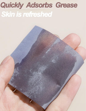 Okerker oil blotting papers being used on face