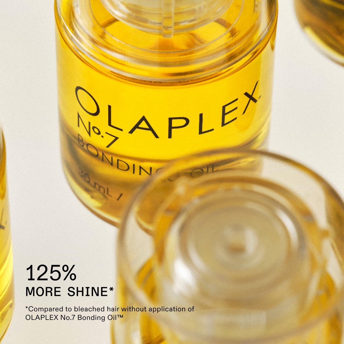 Olaplex No. 7 Bonding Oil with hair styling tools