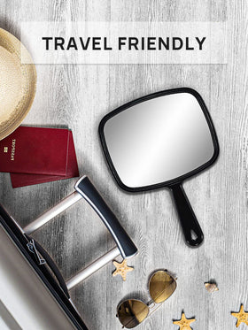 OMIRO Hand Mirror reflecting a clear image of a face