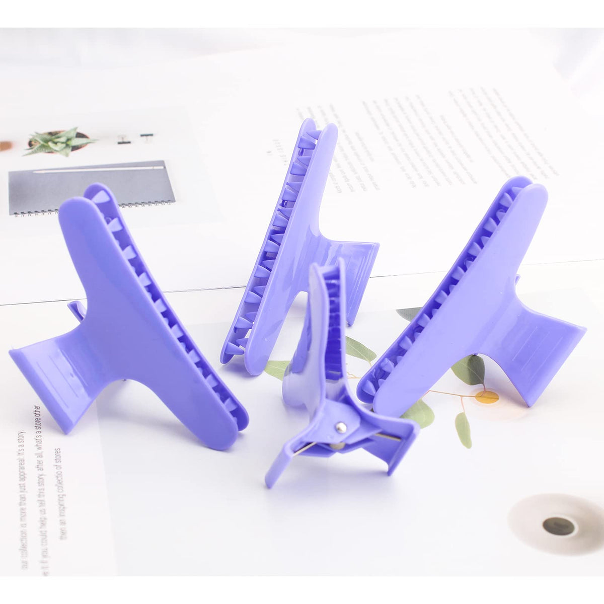 Ondder purple hair clips on a table