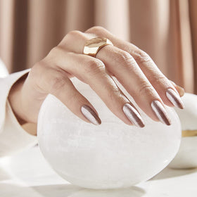 OPI Nail Lacquer Metallic Composition sheer light pink on a nail art display