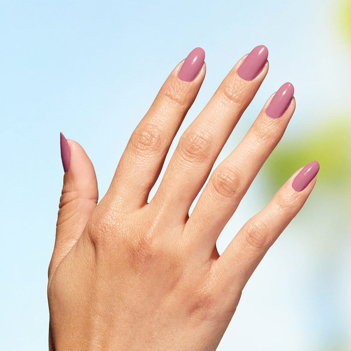 OPI Nature Strong nail polish with nature-inspired background