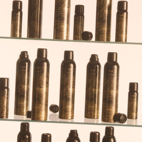 ORIBE Dry Texturizing Spray 2.1oz on a vanity