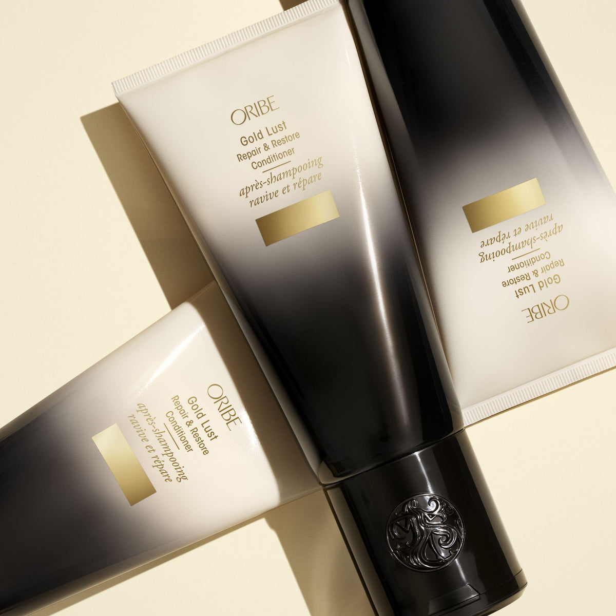 ORIBE Gold Lust Conditioner bottle with nature backdrop