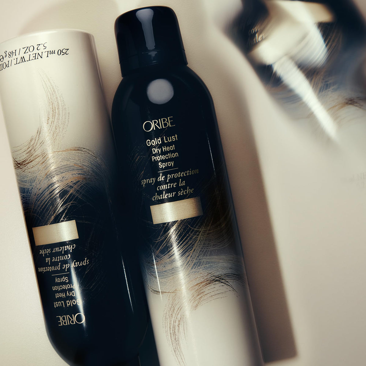 ORIBE Gold Lust Dry Heat Protection Spray with styling tools
